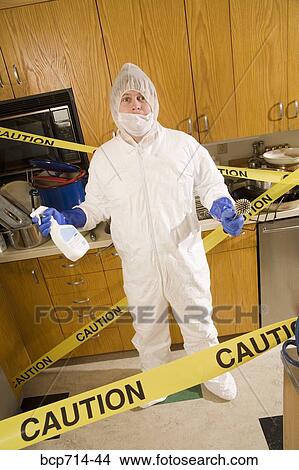 Man wearing coveralls to clean dirty kitchen View Large Photo Image Picture - Man wearing coveralls to clean dirty kitchen. Fotosearch