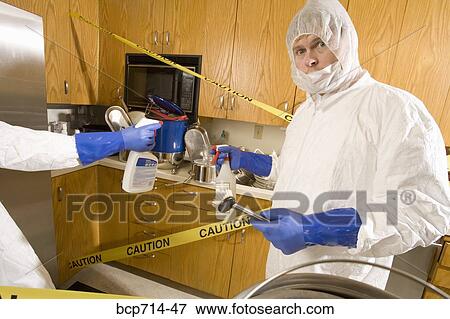 Man wearing coveralls to clean dirty kitchen View Large Photo Image Stock Photo - Man wearing coveralls to clean dirty kitchen. Fotosearch