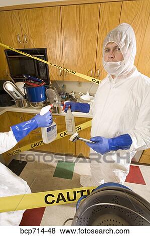 Man wearing coveralls to clean dirty kitchen View Large Photo Image Stock Photo - Man wearing coveralls to clean dirty kitchen. Fotosearch