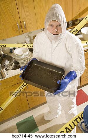 Man wearing coveralls to clean dirty kitchen View Large Photo Image Stock Photography - Man wearing coveralls to clean dirty kitchen. Fotosearch