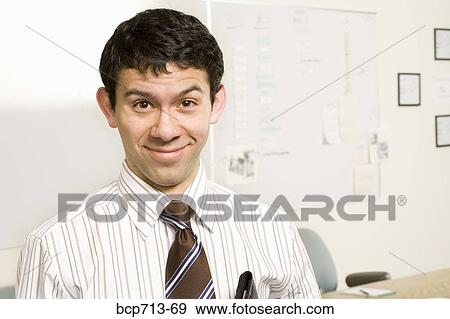 Portrait of businessman in office View Large Photo Image Stock Photo - Portrait of businessman in office. Fotosearch