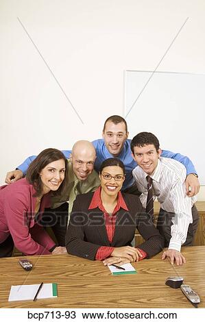 Stock Image - Portrait of businesspeople in office. Fotosearch