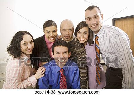 Stock Photo - Portrait of co-workers in office. Fotosearch