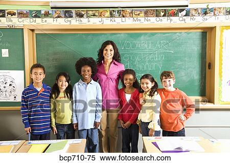 Portrait of female teacher and students in classroom View Large Photo Image Stock Photography - Portrait of female teacher and students in classroom. Fotosearch