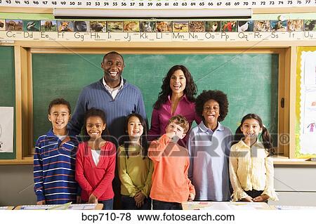 Portrait of teachers and students in classroom View Large Photo Image Stock Photo - Portrait of teachers and students in classroom. Fotosearch