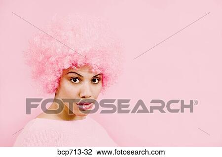 Portrait of woman wearing pink wig View Large Photo Image Stock Image - Portrait of woman wearing pink wig. Fotosearch