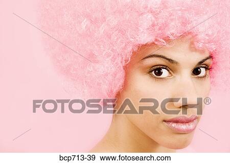 Portrait of woman wearing pink wig View Large Photo Image Stock Photo - Portrait of woman wearing pink wig. Fotosearch