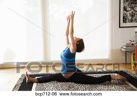 Pregnant woman practicing yoga View Large Photo Image Stock Photograph - Pregnant woman practicing yoga. Fotosearch