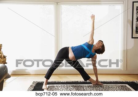 Pregnant woman practicing yoga View Large Photo Image Stock Photography - Pregnant woman practicing yoga. Fotosearch