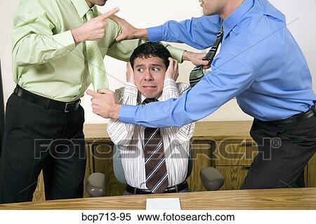 Two businessmen fighting above co-worker View Large Photo Image Stock Photography - Two businessmen fighting above co-worker. Fotosearch