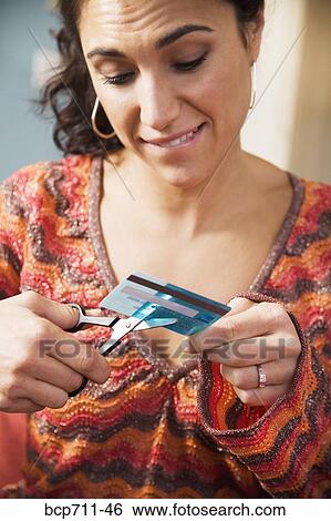 Woman cutting up credit card View Large Photo Image Stock Photograph - Woman cutting up credit card. Fotosearch