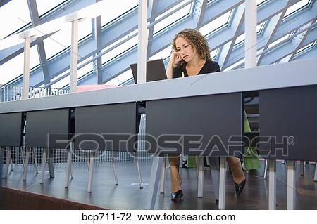 Woman looking at laptop View Large Photo Image Stock Image - Woman looking at laptop. Fotosearch