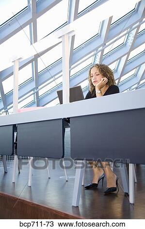Woman looking at laptop View Large Photo Image Stock Image - Woman looking at laptop. Fotosearch
