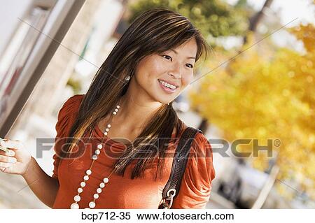 Woman smiling outdoors View Large Photo Image Stock Photography - Woman smiling outdoors. Fotosearch