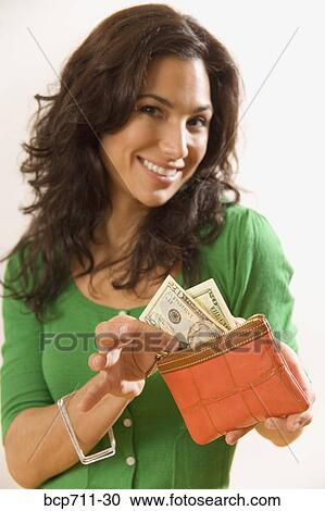 Woman taking money out of wallet View Large Photo Image Stock Image - Woman taking money out of wallet. Fotosearch