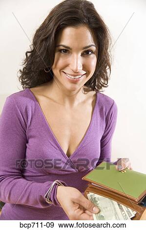 Woman taking money out of wallet View Large Photo Image Stock Photo - Woman taking money out of wallet. Fotosearch