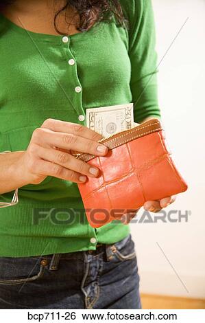 Woman taking money out of wallet View Large Photo Image Stock Photograph - Woman taking money out of wallet. Fotosearch