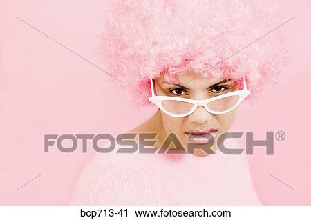 Woman wearing pink wig and eyeglasses View Large Photo Image Stock Image - Woman wearing pink wig and eyeglasses. Fotosearch