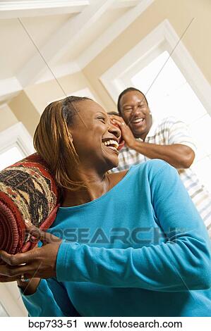 African couple carrying rug View Large Photo Image Stock Image - African couple carrying rug. Fotosearch