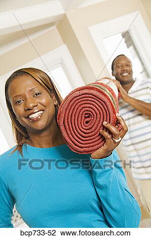 African couple carrying rug View Large Photo Image Stock Image - African couple carrying rug. Fotosearch