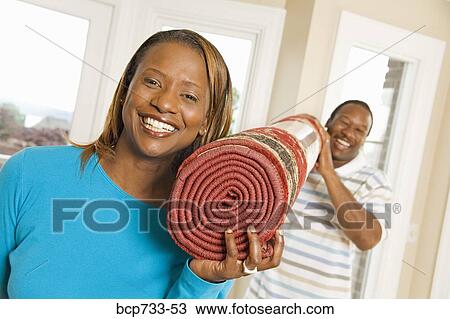 African couple carrying rug View Large Photo Image Stock Image - African couple carrying rug. Fotosearch
