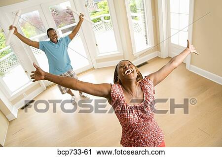 African couple cheering in new house View Large Photo Image Stock Image - African couple cheering in new house. Fotosearch