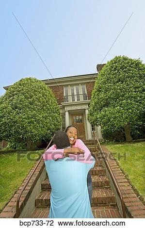 African couple in front of new house View Large Photo Image Stock Image - African couple in front of new house. Fotosearch