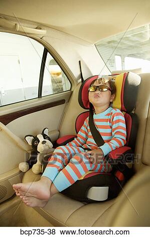 Asian boy in car seat View Large Photo Image Stock Photo - Asian boy in car seat. Fotosearch