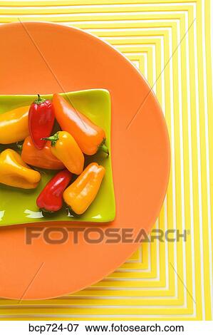 Assorted peppers on plate View Large Photo Image Stock Photo - Assorted peppers on plate. Fotosearch