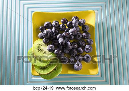 Blueberries and kiwi View Large Photo Image Stock Photo - Blueberries and kiwi. Fotosearch