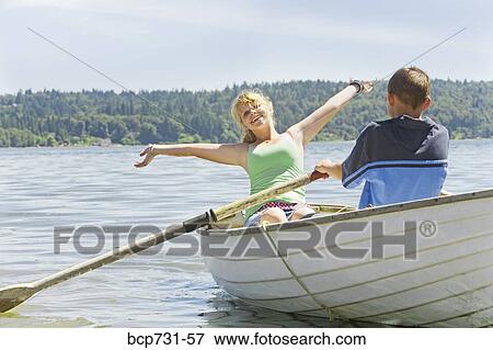Boy and girl in row boat View Large Photo Image Stock Photo - Boy and girl in row boat. Fotosearch