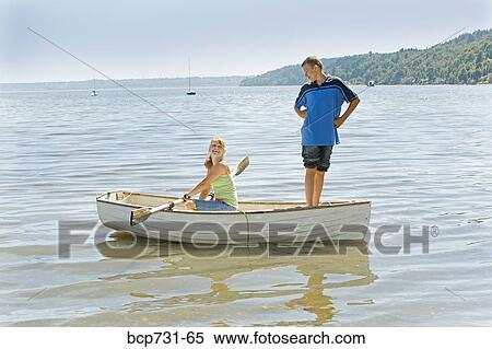 Boy and girl in row boat View Large Photo Image Stock Photography - Boy and girl in row boat. Fotosearch