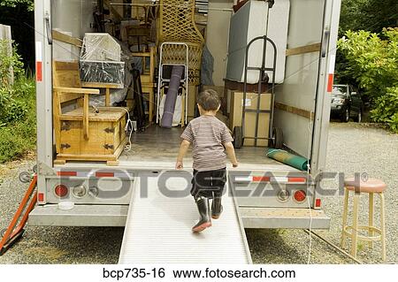 Boy walking into moving truck View Large Photo Image Stock Photograph - Boy walking into moving truck. Fotosearch