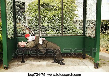 Businessman holding baby at bus stop View Large Photo Image Stock Photography - Businessman holding baby at bus stop. Fotosearch