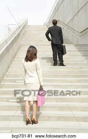 Businesspeople looking up steps View Large Photo Image Stock Image - Businesspeople looking up steps. Fotosearch