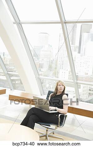 Businesswoman typing on laptop View Large Photo Image Stock Image - Businesswoman typing on laptop. Fotosearch