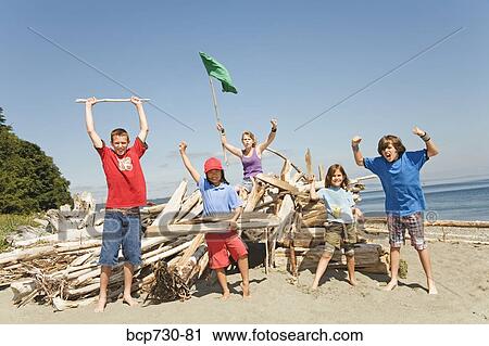 Children cheering next to beach fort View Large Photo Image Stock Image - Children cheering next to beach fort. Fotosearch