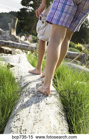 Children walking on driftwood View Large Photo Image Stock Photography - Children walking on driftwood. Fotosearch
