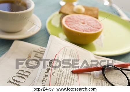 Circled classified ad next to breakfast View Large Photo Image Stock Photo - Circled classified ad next to breakfast. Fotosearch