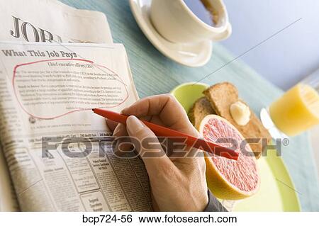 Circled classified ad next to breakfast View Large Photo Image Stock Photograph - Circled classified ad next to breakfast. Fotosearch