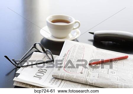 Circled classified ad next to coffee cup and telephone View Large Photo Image Stock Image - Circled classified ad next to coffee cup and telephone. Fotosearch