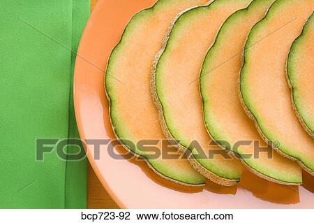 Close up of cantaloupe slices View Large Photo Image Stock Image - Close up of cantaloupe slices. Fotosearch