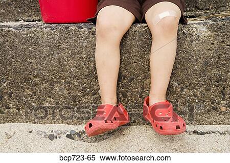 Close up of young boy’s legs on steps View Large Photo Image Stock Photography - Close up of young boy’s legs on steps. Fotosearch