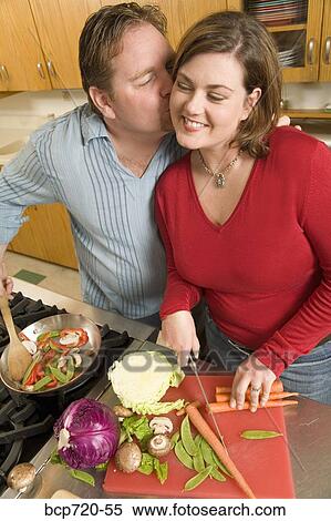 Couple cooking together View Large Photo Image Stock Photography - Couple cooking together. Fotosearch
