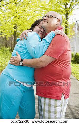 Couple hugging outside View Large Photo Image Stock Image - Couple hugging outside. Fotosearch