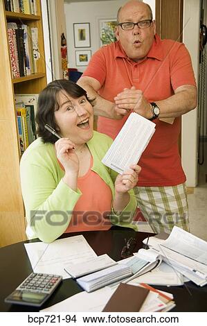 Couple paying bills View Large Photo Image Picture - Couple paying bills. Fotosearch