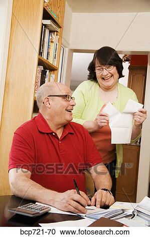 Couple paying bills View Large Photo Image Stock Image - Couple paying bills. Fotosearch