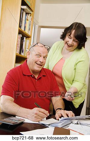 Couple paying bills View Large Photo Image Stock Photo - Couple paying bills. Fotosearch