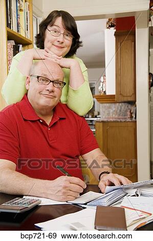 Couple paying bills View Large Photo Image Stock Photo - Couple paying bills. Fotosearch