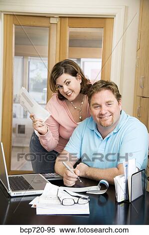 Couple paying bills View Large Photo Image Stock Photography - Couple paying bills. Fotosearch